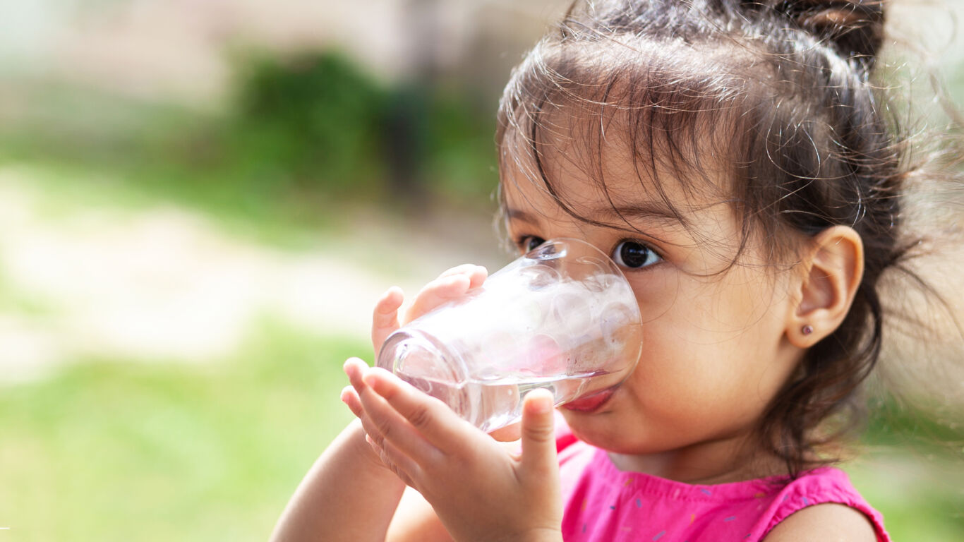 child with glass of water